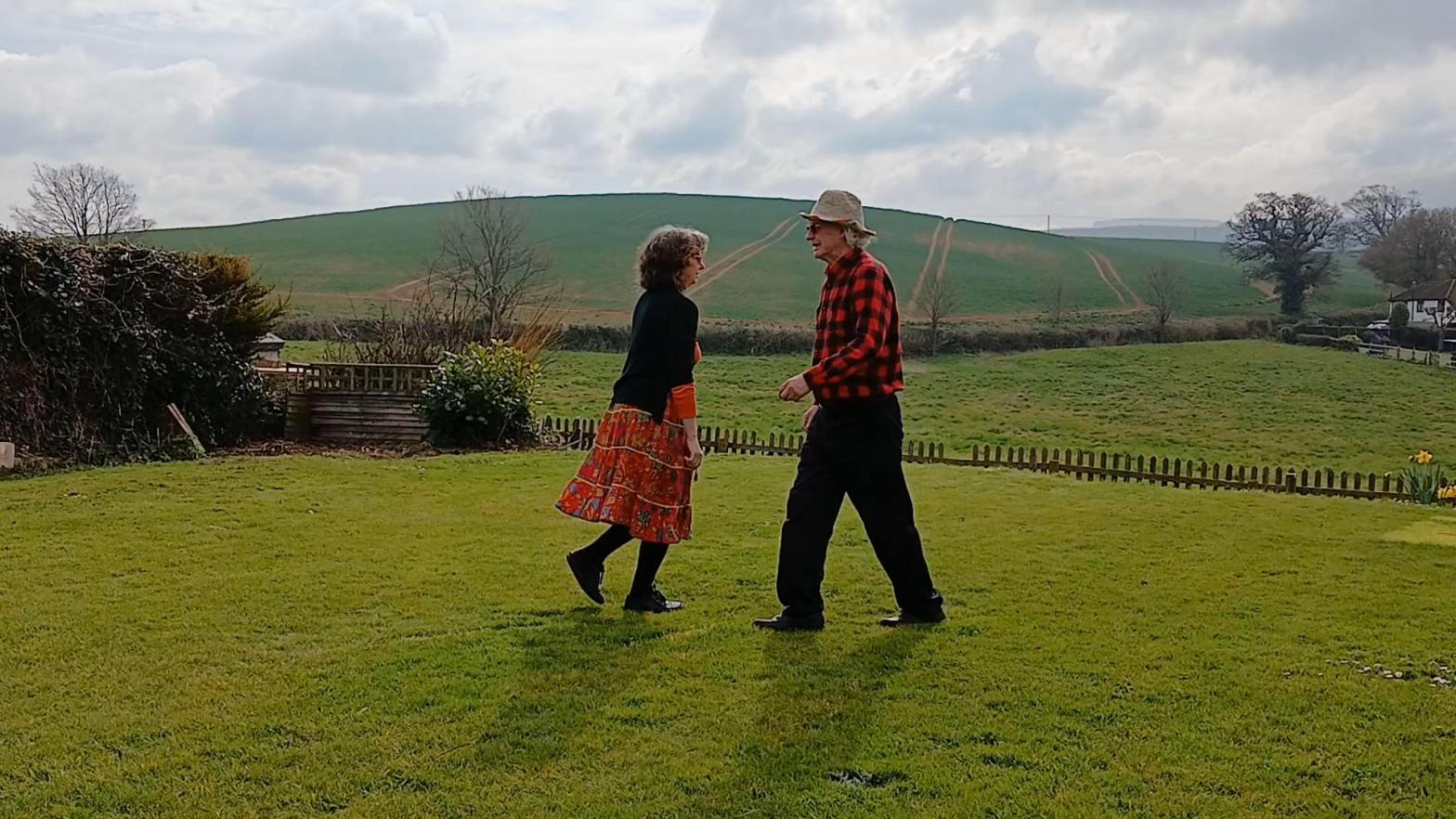 Middle of a do-si-do in a garden