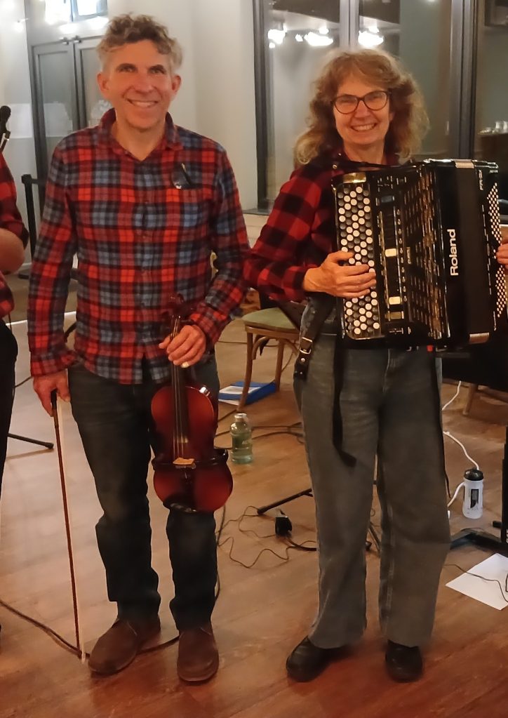 Rob with his violin and Judy with her accordion