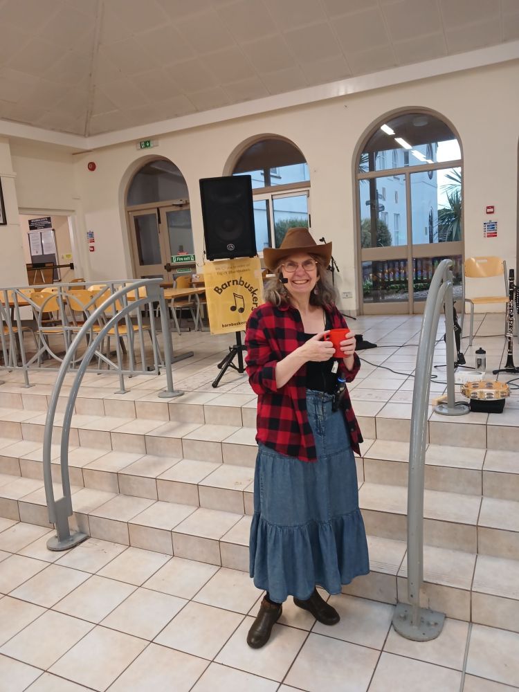 Judy Mapledoram calling country dances at Sidcot School Reunion